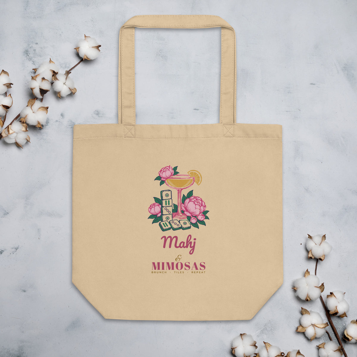 Mahj & Mimosas Tote Bag in Oyster, flat lay on marble