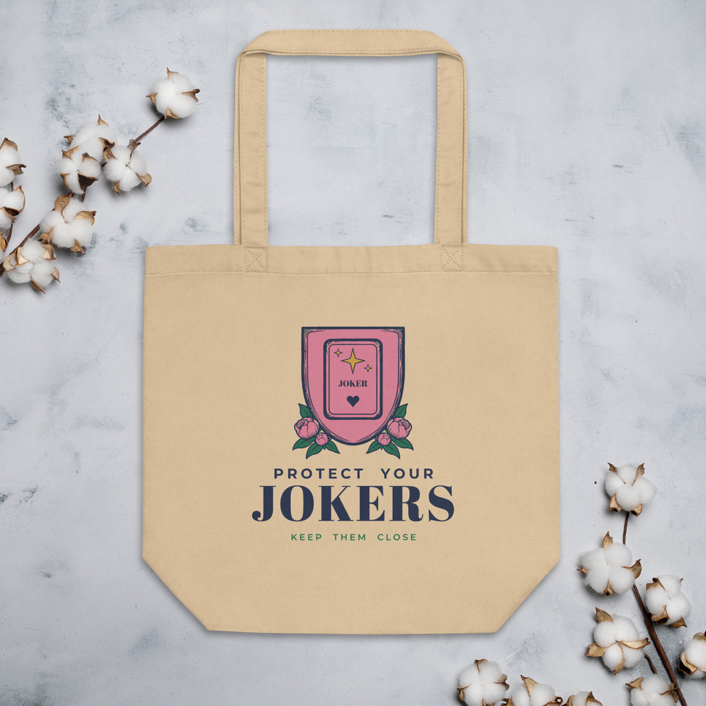 Protect Your Jokers Tote Bag in Oyster, flat lay on marble