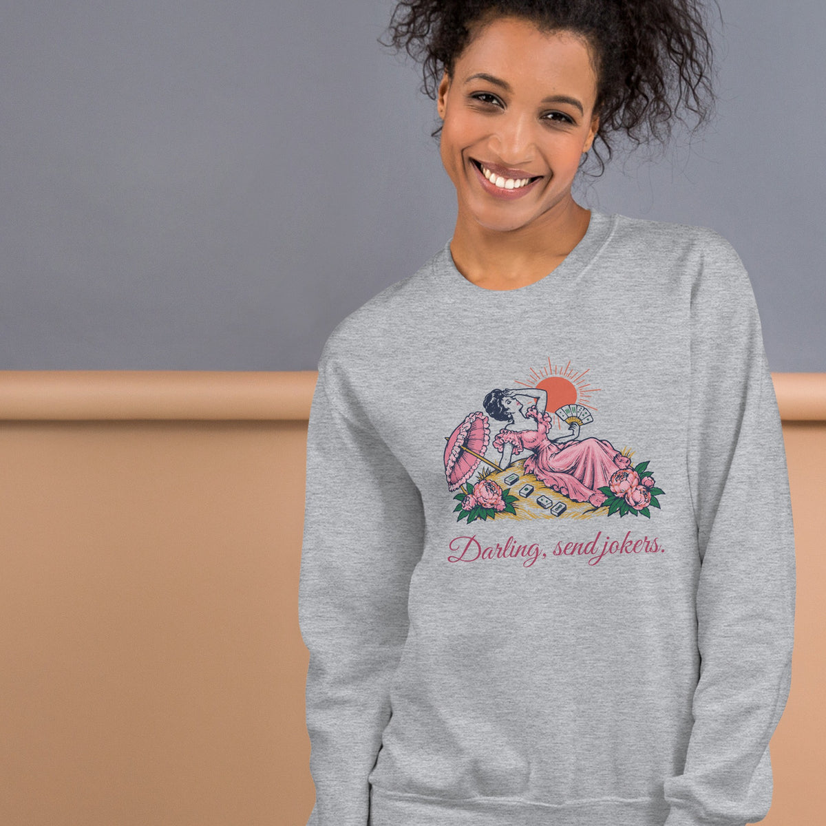 Woman wearing the Darling, Send Jokers Crewneck in Sport Grey